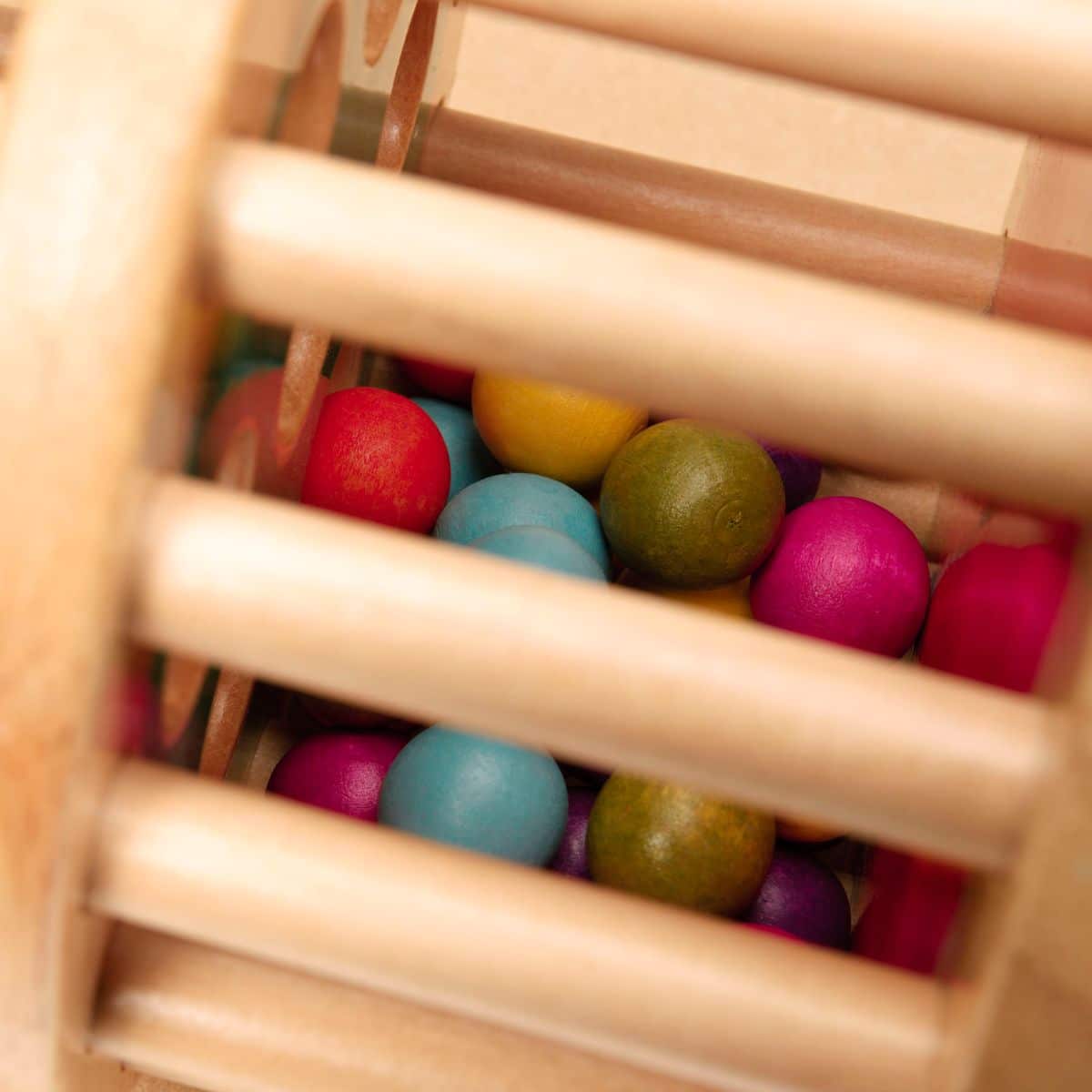 Rolling tower filled with colourful wooden marbles