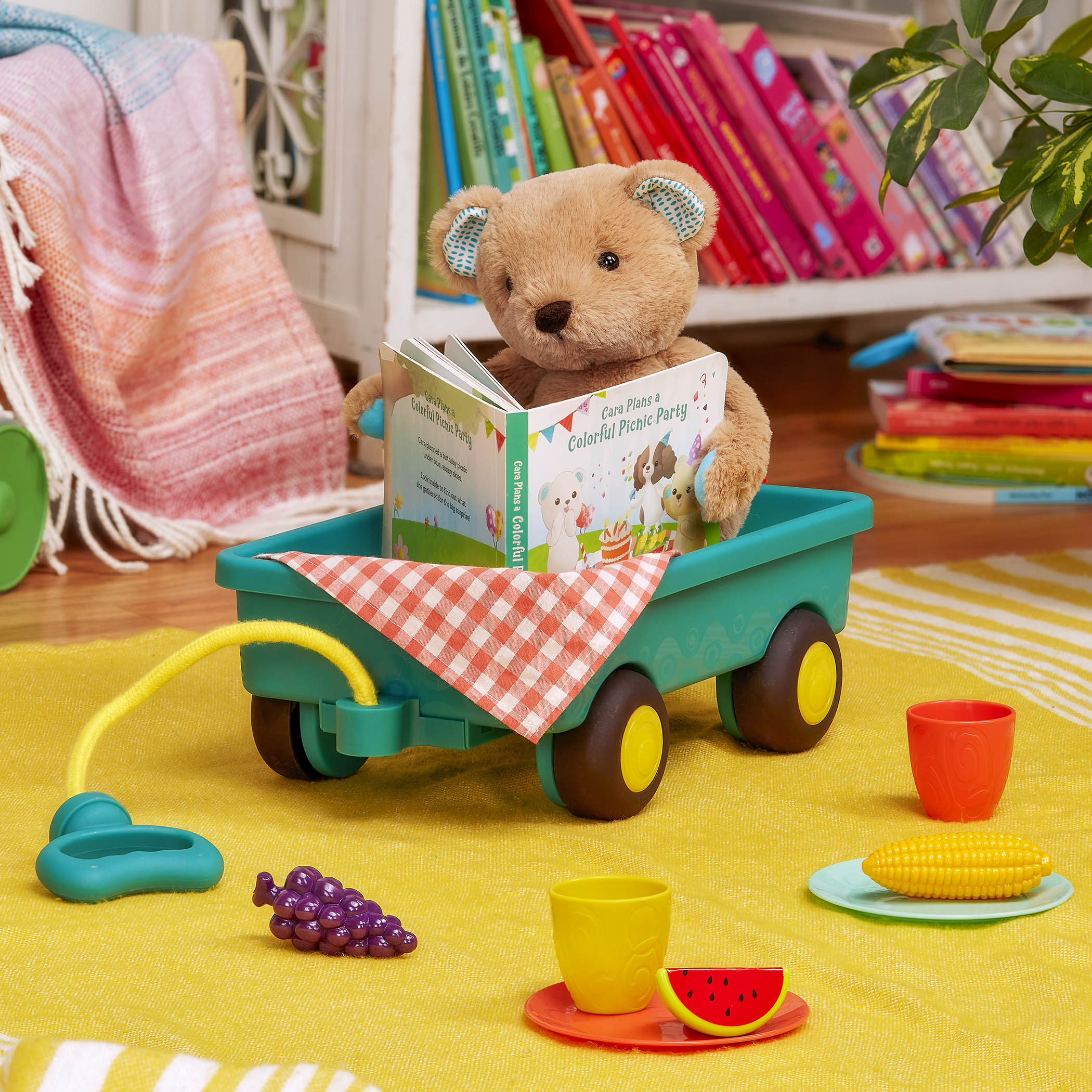 Plush bear with picnic playset and book.