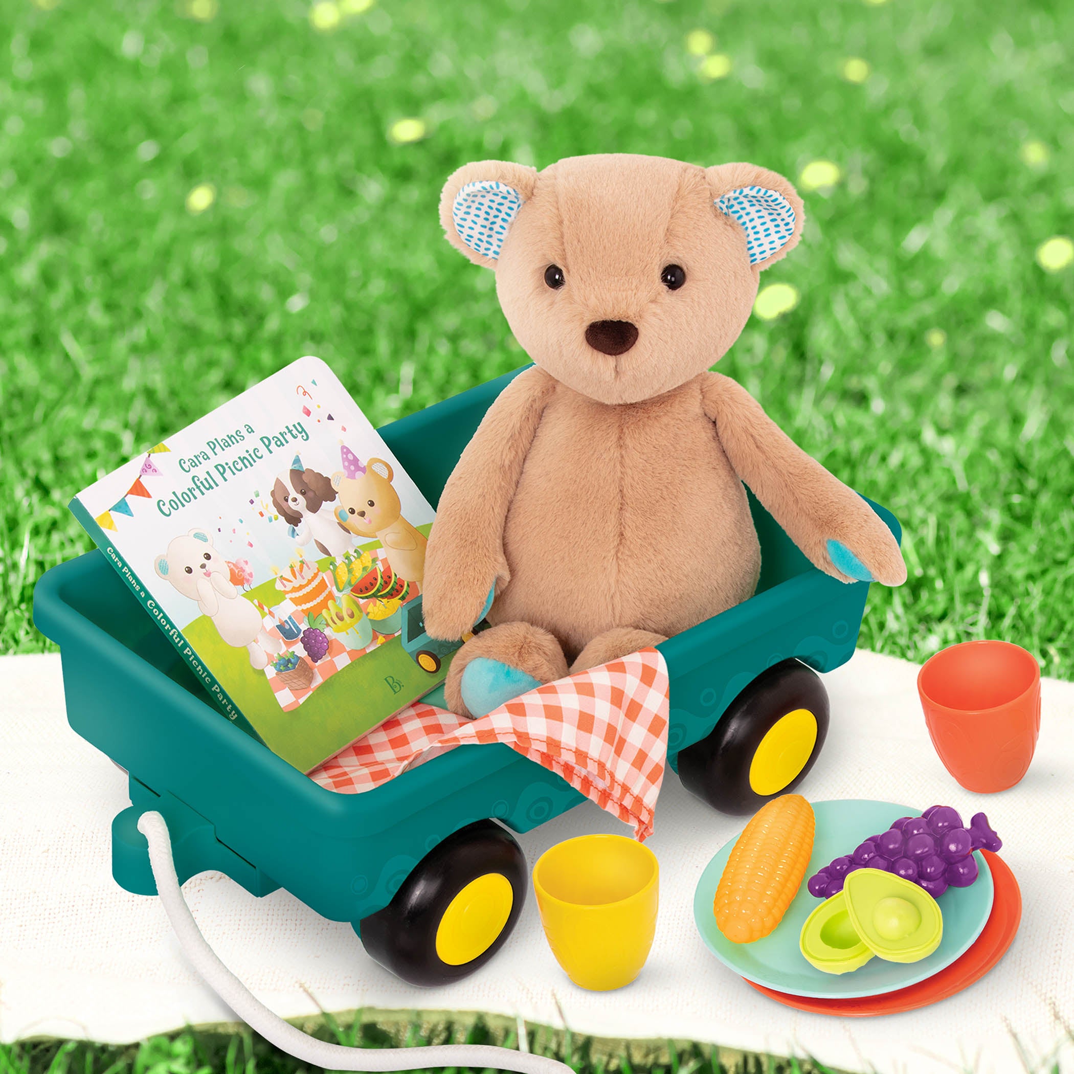 Plush bear with picnic playset and book.